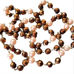 Brown and pearl-like strand necklace